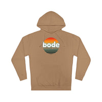 The 2026 Bode Summer Bootcamp — Cali Sunset Hoodie Sweatshirt - SS4500 by Printify is a soft cotton-poly fleece tan hoodie with a front pocket and retro "bode SUMMER CAMP" graphic with an orange sunset on the chest.