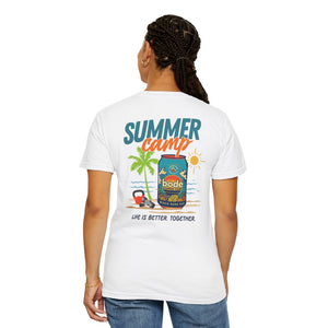 A person stands with their back to the camera wearing the Printify Summer Camp T-Shirt, featuring a vibrant beach can design and the phrase "Life Is Better Together.