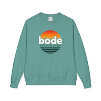 The 2026 Bode Summer Bootcamp Crewneck Sweatshirt (GDH400) by Printify features a teal vintage-washed fleece, an extra soft feel, and a “bode SUMMER CAMP” logo with an orange-yellow sunset graphic above black waves.