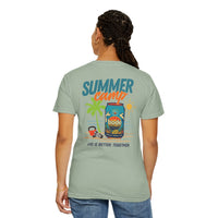 A person faces away wearing the BODE Summer Camp T-Shirt 2026 by Printify, a light green unisex Comfort Colors 1717 tee featuring a vibrant "Summer camp" graphic and “Life’s Better Together” text on the back with durable double-needle stitching.