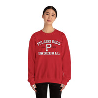 Someone wearing the Printify P Reds Baseball Est. 1978 - Unisex Heavy Blend™ Crewneck Sweatshirt, a vintage red pullover featuring "Pulaski Reds Baseball Est. 1978" and a bold "P" on the front.