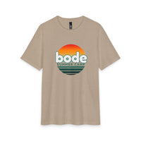 The Printify 2026 Bode Summer Bootcamp - Cali Sunset T-Shirt (DM130 Tri Blend) features a retro "bode summer camp" sunset logo in orange, red, and green on beige tri-blend fabric for lightweight, breathable comfort.
