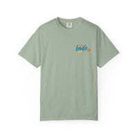 The BODE Summer Camp T-Shirt 2026 by Printify features a light green Comfort Colors 1717 tee with a small, colorful "Life's Better Together" graphic and flower on the left chest, made from heavyweight cotton for comfort and lasting style.
