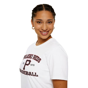 A woman smiles in a Printify P Reds Baseball Est. 1978 Unisex Softstyle T-Shirt, featuring a white cotton style with "Pulaski Reds Baseball Est. 1978" and a "P" logo, standing against a plain white background.
