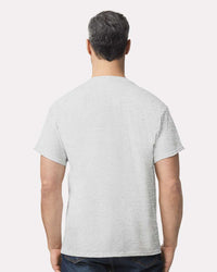 Man shown from the back wearing a Gildan 2300 Ultra Cotton® Pocket T-Shirt in light gray and dark jeans, against a plain background. Sold as a pack of 36, includes custom screen-printed logo, made by Gildan with sustainable practices.