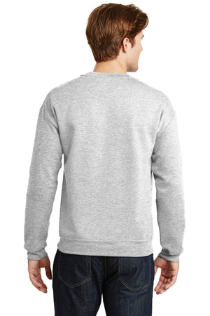 A man with brown hair is shown from the back, wearing a gray Gildan Heavy Blend Crewneck Sweatshirt 18000 and dark jeans.