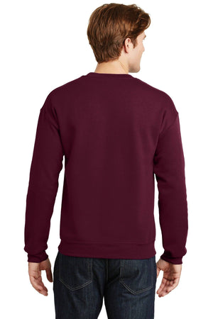A person is shown from behind wearing a maroon custom Gildan Heavy Blend Crewneck Sweatshirt 18000 and dark jeans.