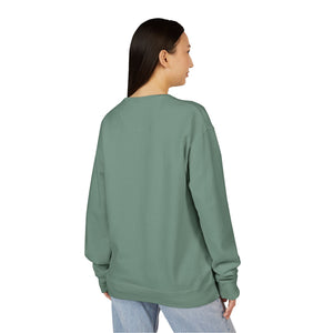 A person with straight dark hair, wearing the Printify 2026 Bode Summer Bootcamp Crewneck Sweatshirt GDH400 in sage green and light blue jeans, stands with their back to the camera.