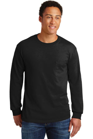 A man in blue jeans and a plain black Gildan Ultra Cotton 100% Long Sleeve T-Shirt with Pocket (Pack of 36, 2410) with custom screen printed logo stands against a white background, highlighting this classic heavy-duty style.