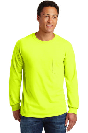 A man in blue jeans wears a bright yellow Gildan Ultra Cotton Long Sleeve T-Shirt with pocket (Pack of 36, style 2410, custom screen printed logo included) and stands slightly turned to the side.