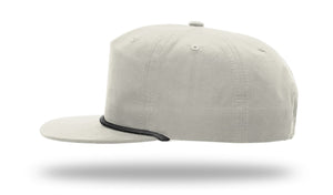 Side view of a light gray Richardson 256 Umpqua Rope Snapback Cap with black trim near the brim, set against a white background with the cap appearing to float.