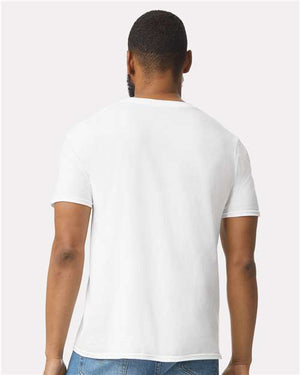 A man with his back to the camera wears a plain white Gildan 64000 Softstyle® T-shirt (pack of 36, custom screen printed logo included) and blue jeans against a light background.