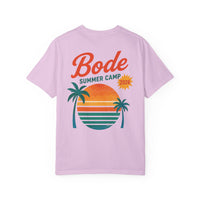 The BODE Summer Camp T-Shirt 2026—"Throwback Sunset" by Printify features a light purple heavyweight cotton Comfort Colors 1717 and a back graphic of two palm trees, striped sunset, and "Bode Summer Camp 2026" text—ideal for summer.
