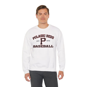 A man wears the Printify P Reds Baseball Est. 1978 Unisex Heavy Blend™ Crewneck Sweatshirt, featuring vintage lettering, while standing against a plain white background.