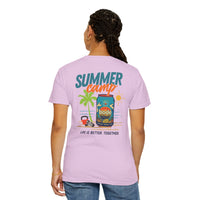A woman wears the Printify BODE Summer Camp T-Shirt 2026—"Life's Better Together," a unisex Comfort Colors 1717 in light purple, featuring a playful camp graphic and inspiring text on the back.