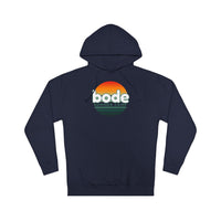 The 2026 Bode Summer Bootcamp — Cali Sunset Hoodie Sweatshirt - SS4500 by Printify is a navy blue hoodie with "bode SUMMER CAMP" text and a retro sunset graphic on the chest, made from soft cotton-poly fleece.