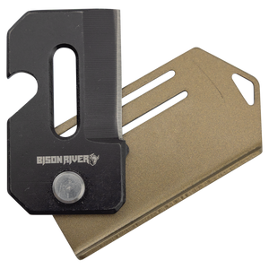 A compact black Bison River 2" Everyday Carry Knife rests on a flat gold metal card with slots and a keyring hole—perfect as custom laser engraved corporate gifts or promotional giveaways.