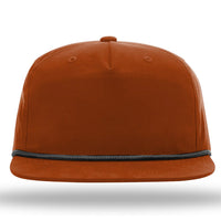 A front view of the Richardson 256 Umpqua Rope Snapback Cap in brown, accented with a black trim around the base, featuring UPF 50+ protection.