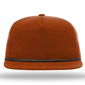A front view of the Richardson 256 Umpqua Rope Snapback Cap in brown, accented with a black trim around the base, featuring UPF 50+ protection.