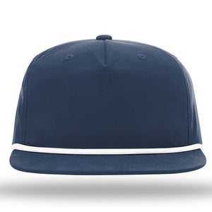 A Richardson 256 Umpqua Rope Snapback Cap in dark blue, featuring a flat brim with a white accent line along the edge and UPF 50+ protection.