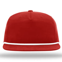 The Richardson 256 Umpqua Rope Snapback Cap, a custom rope hat featuring a leather patch, sports a red color with white trim along the visor and provides UPF 50+ protection. The cap is displayed against a white background.
