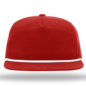 The Richardson 256 Umpqua Rope Snapback Cap, a custom rope hat featuring a leather patch, sports a red color with white trim along the visor and provides UPF 50+ protection. The cap is displayed against a white background.