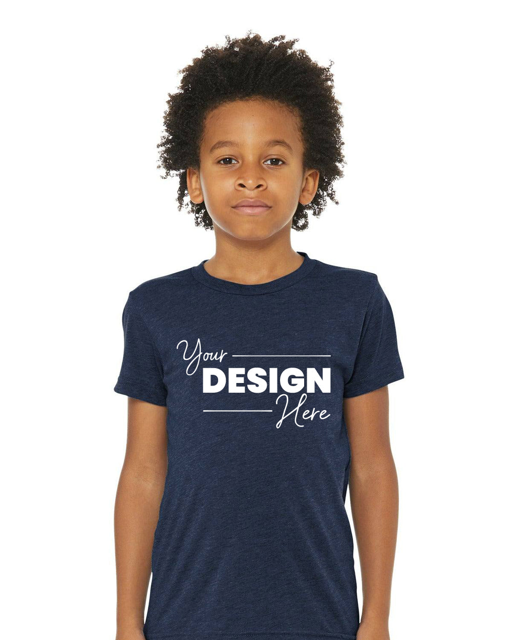 A child showcases a trendy look in a Bella + Canvas Youth Triblend Short Sleeve T-Shirt BC3413Y. This customizable dark blue tee prominently displays "Your Design Here" in white on the front, blending style with creativity.