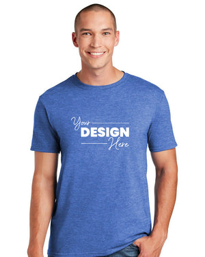 A man in a Gildan Softstyle T-Shirt 64000 by Gildan, featuring a stylish blue design crafted from soft, ring-spun cotton with "Your Design Here," stands against a white background. The modern classic fit and tearaway label enhance its versatile appeal.