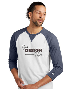 A man in a white and blue New Era Cotton Blend 3/4-Sleeve Baseball Raglan T-Shirt (NEA121) with "Your Design Here" stands against a plain white background, highlighting the ideal canvas for your custom New Era style.