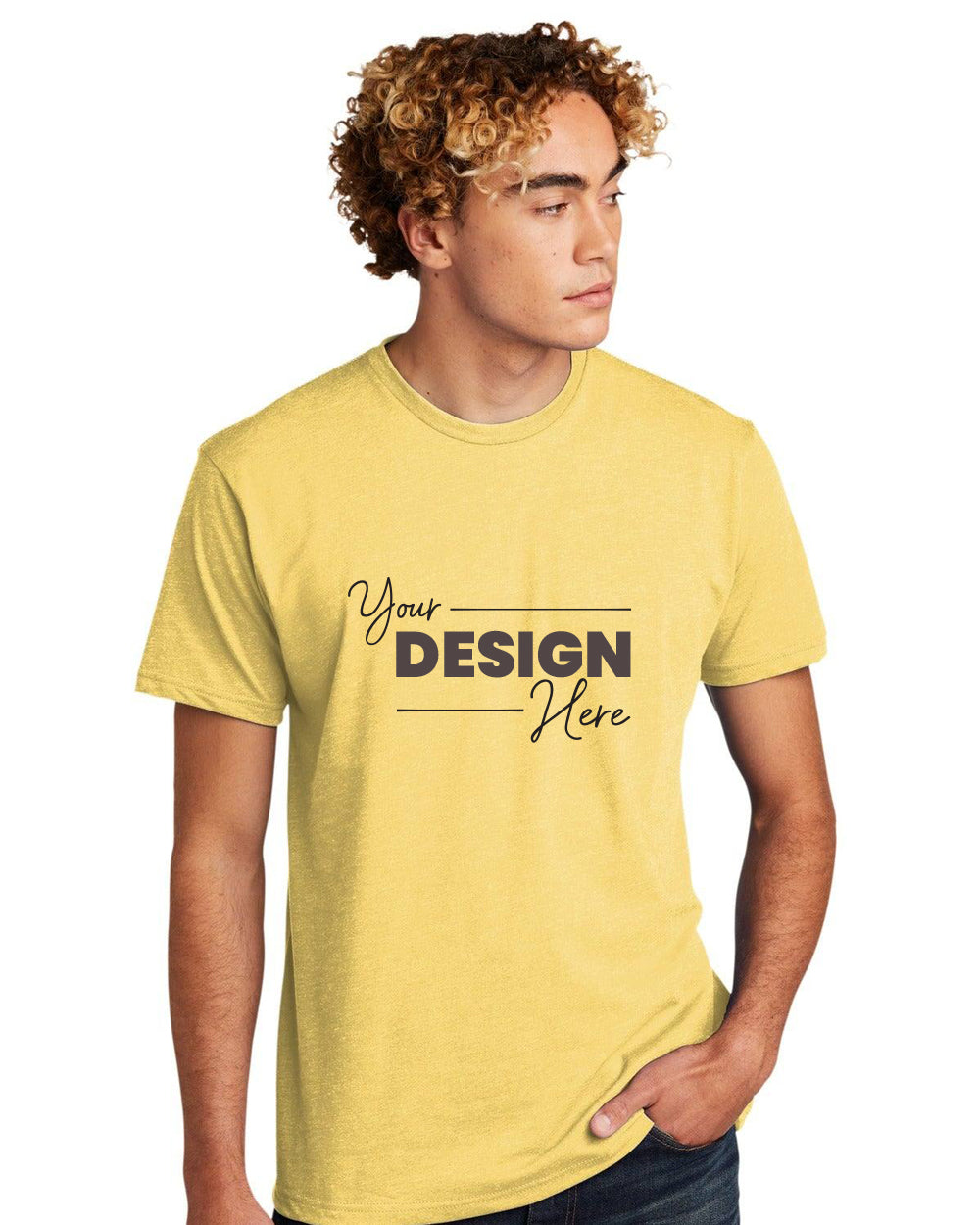 A person wearing a high-quality, durable yellow Next Level Apparel Unisex CVC T-Shirt NL6210 with "Your Design Here" text is standing with one hand in their pocket.