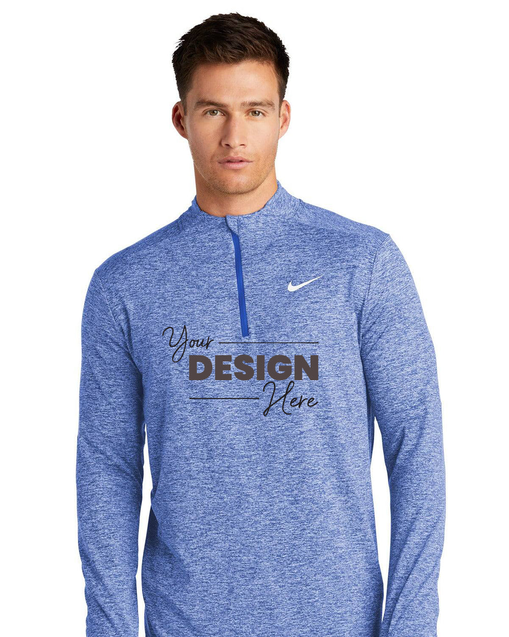 A man wears a blue Nike Dri-FIT Element 1/2-Zip Pullover (NKDH4949) with "Your Design Here" on the front, blending all-utility warmth, style, and moisture-wicking comfort.