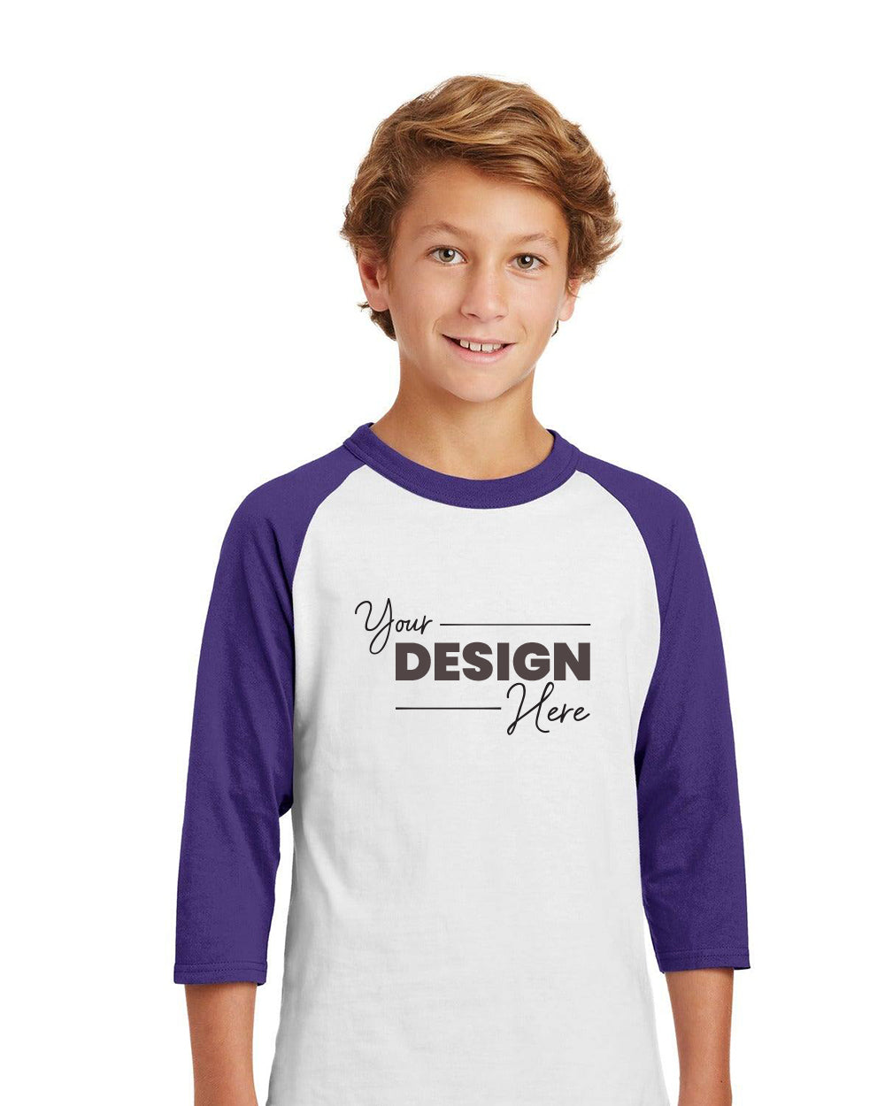 A young person is wearing the Sport-Tek Youth Colorblock Raglan Jersey T-Shirt YT200 in white and purple, which features a striking "Your Design Here" print on the front. This shirt is ideal for creating custom team shirts or personalized youth sports jerseys.