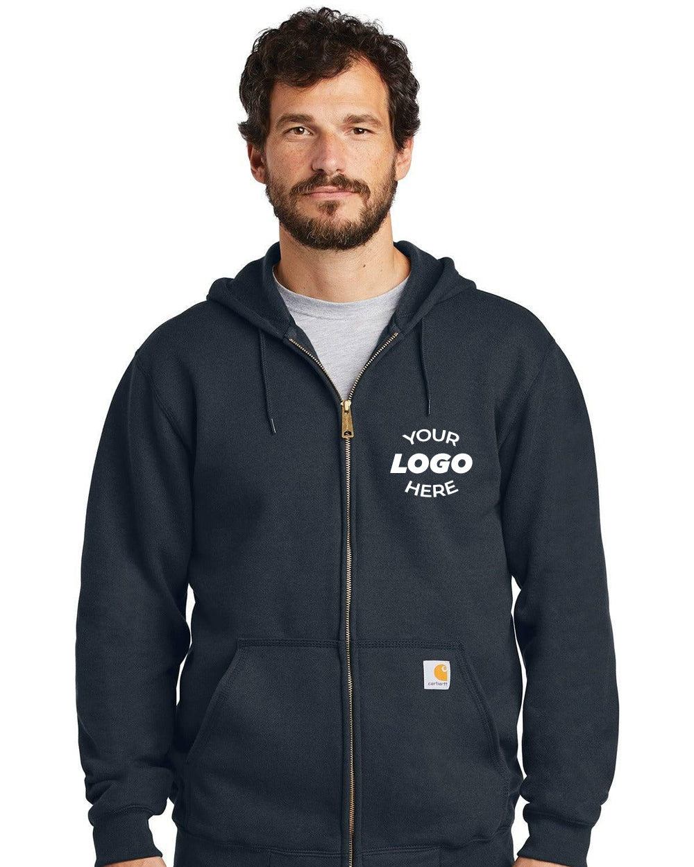 A man wearing a black Carhartt Midweight Zip-Front Hoodie Sweatshirt CTK122 with "YOUR LOGO HERE" on the left chest stands against a white background—ideal for custom sweatshirt options and durable Carhartt apparel seekers.