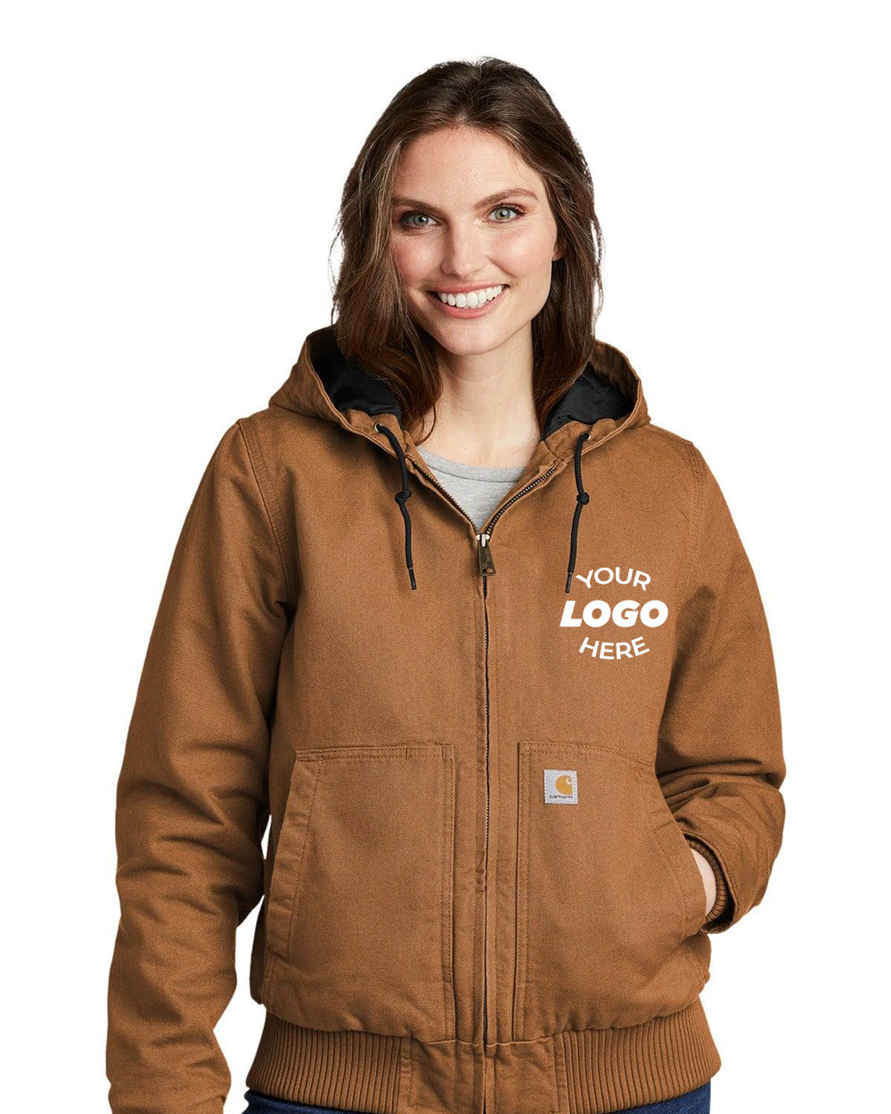 A person wearing a Carhartt Women's Washed Duck Active Jacket CT104053, characterized by "Your Logo Here" on the front and enhanced with 3M Thinsulate Insulation, stands against a plain white background.