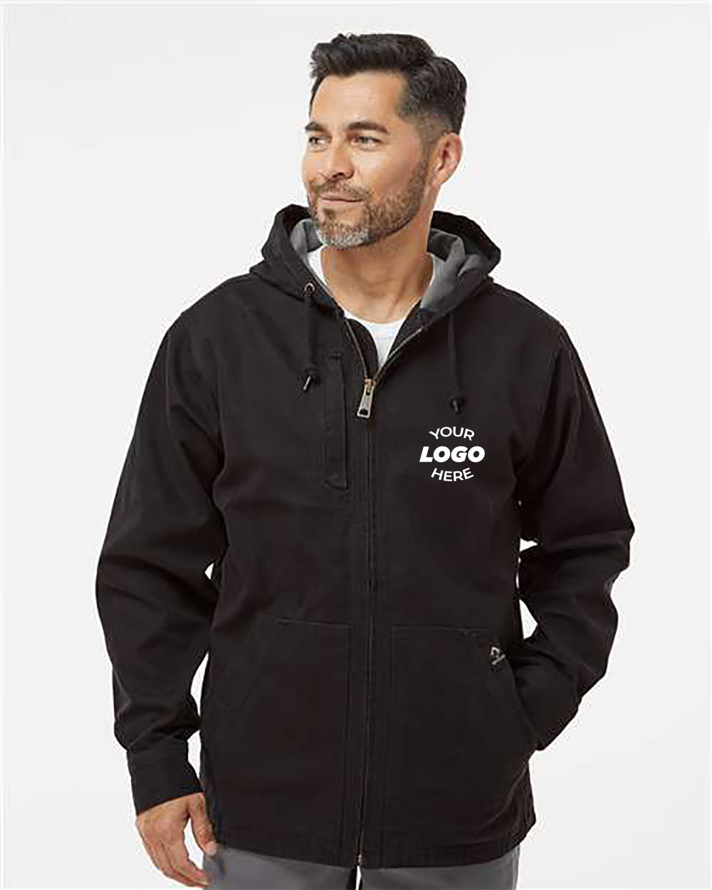 A man wearing a DRI DUCK Laredo Boulder Cloth Canvas Jacket with Thermal Lining featuring the text "Your Logo Here" printed on the chest, standing against a plain white background.