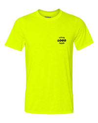 A neon yellow Gildan Performance Safety T-Shirt with the text "Your Logo Here" printed in black on the left chest area. Made by Gildan from 100% polyester, this round-neck, short-sleeve T-shirt is perfect for bulk customized orders and offers excellent moisture-wicking properties.