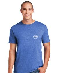 A man wearing a Gildan Softstyle T-Shirt 64000, made of ring spun cotton, with "YOUR LOGO HERE" printed on the chest, poses against a white background.