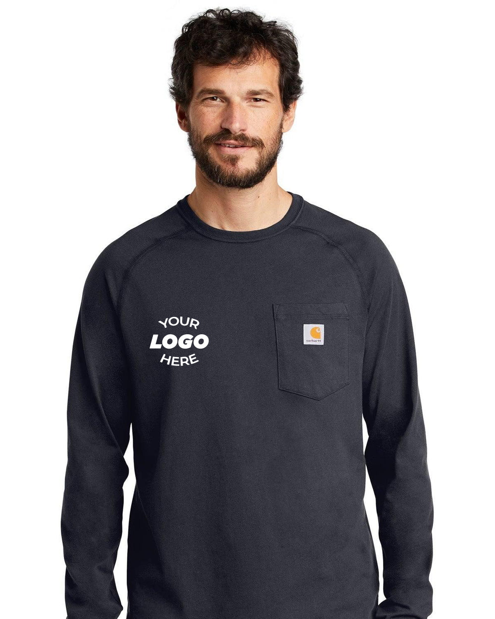 A bearded man wears a Carhartt Force Cotton Delmont Long Sleeve Pocket T-Shirt CT100393 in black, featuring "Your Logo Here" text on the left chest area, designed for enhanced comfort.