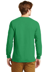 A man faces away, wearing a Gildan 100% US cotton long-sleeve green T-shirt (Pack of 36, style 2400, custom screen printed logo included) and brown pants against a plain white background.