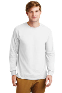 A man wearing a Gildan 100% US Cotton Long Sleeve T-Shirt 2400 with a custom screen printed logo and tan pants stands facing forward against a white background.