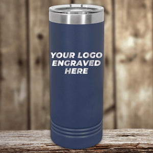 Custom Logo 22 oz Skinny Tumbler with "your custom logo engraved here" text, displayed on a wooden surface with blurred background by Kodiak Coolers.
