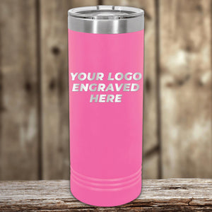 Pink insulated Custom Logo 22 oz Skinny Tumbler with "your logo engraved here" text, perfect as a promotional gift, displayed on a wooden surface against a blurred background. (Brand Name: Kodiak Coolers)