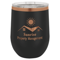 The "NEW - ION Plated Tumblers" by Kodiak Coolers, custom engraved with a "Ghost Black & Rose Gold" color scheme, showcase a copper-colored "Sunrise Property Management" logo featuring a sun and rooftops, making them an excellent promotional gift choice for your business partners.
