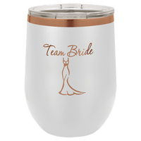 Experience a touch of elegance with our NEW Kodiak Coolers ION Plated Tumbler, featuring custom engraving in "Ghost Black & Rose Gold," and adorned with the text "Team Bride" above an illustration of a gown. This beautifully crafted mug is the perfect personalized gift for weddings or bachelorette parties.