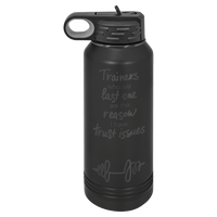 The NEW ION Plated Tumblers by Kodiak Coolers, custom engraved drinkware with the special engraving color "Ghost Black & Rose Gold," features a black water bottle with a handle on the lid and the humorous text: "Trainers who say last one are the reason I have trust issues." This stylish accessory is perfect as a logo promotional gift for fitness enthusiasts or those looking to add a touch of humor to their daily routine.