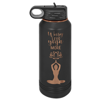 A Ghost Black & Rose Gold ION plated tumbler from Kodiak Coolers, custom engraved with a motivational yoga-themed design that includes the phrase "Worry Less, Yoga More" and an illustration of a person in a meditative pose—perfect as a logo promotional gift.