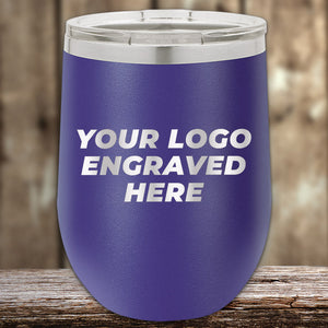 A purple Kodiak Coolers tumbler with a clear lid sits on a wooden surface, featuring your custom logo engraved on the front—ideal for promotional gifts during the 4th of July SALE with a $200 minimum order.