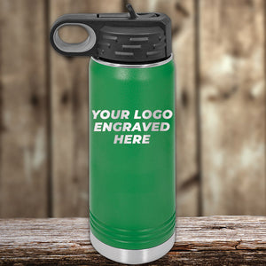 A green Kodiak Coolers water bottle with a black lid, featuring a front engraved custom logo, sits on a wooden surface—perfect to pair with engraved can holders for personalized drinkware sets. 4th of July SALE, $200 minimum order.