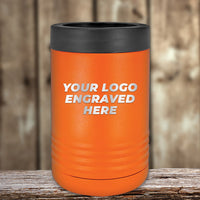 A Kodiak Coolers orange insulated can holder with a black lid sits on wood, featuring your engraved logo—perfect for custom promotional gifts. 4th of July SALE: Engraved Custom Logo Drinkware, $200 minimum order.