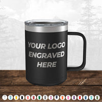 A black Kodiak Coolers insulated tumbler with a clear lid and a handle, featuring the text "your custom logo engraved here" displayed on a wooden surface.